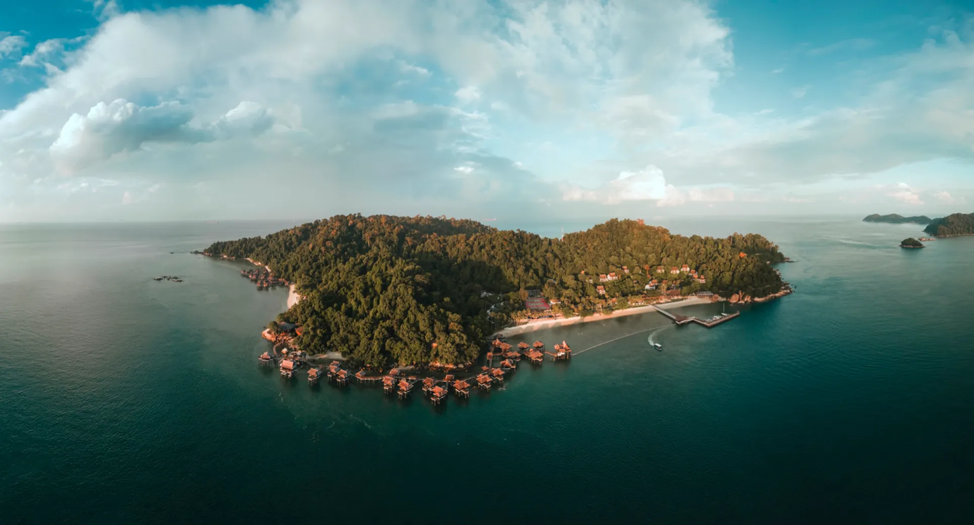 Aerial view of the private island in Pangkor, Malaysia, with overwater villas along the shoreline
