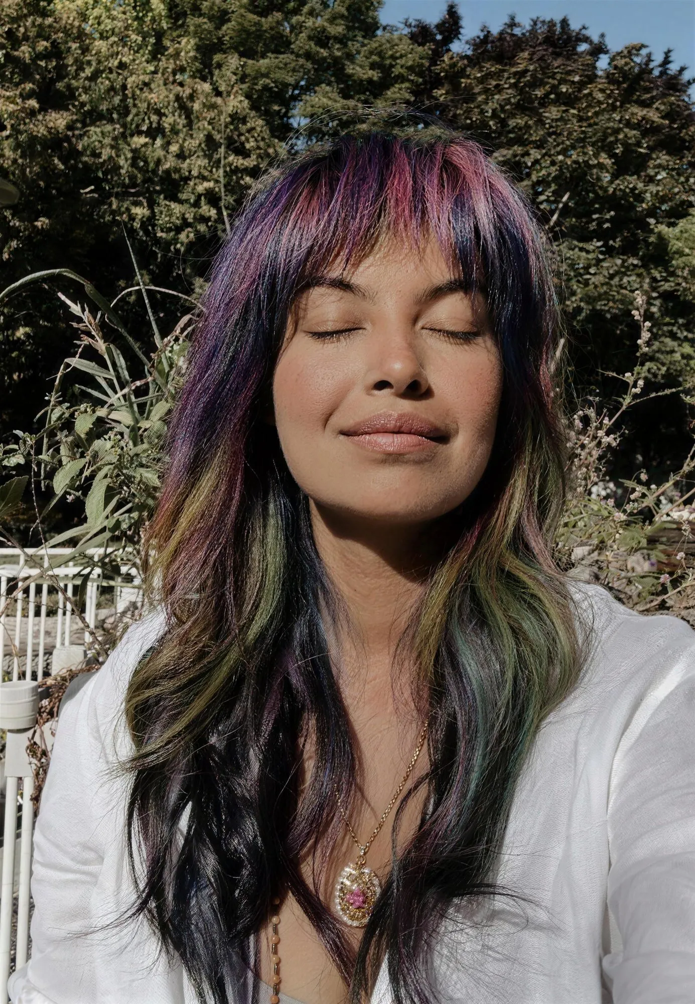 Zineea with her eyes closed, face turned to the sun